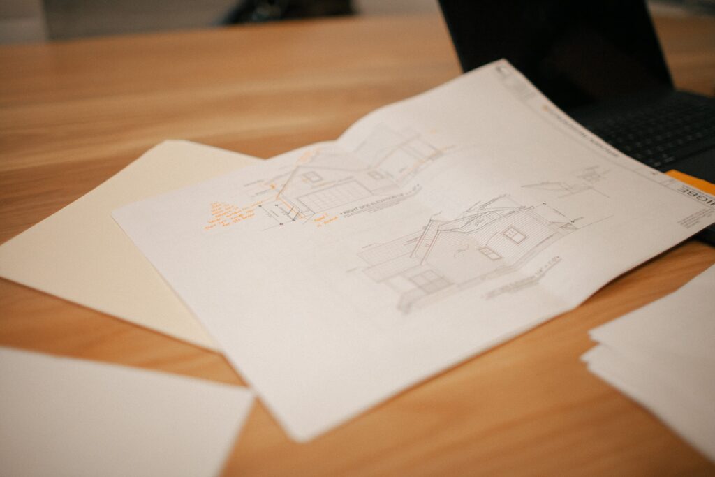 Custom home plans on conference table at The WilsonCo office in Cayce South Carolina