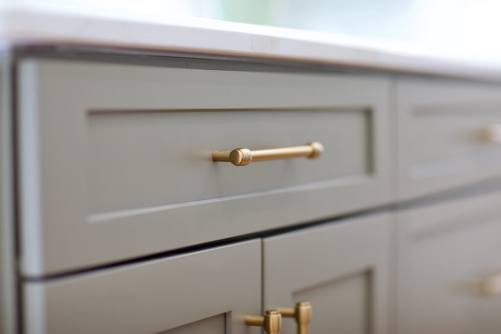 Close-up of custom Wilson Co cabinetry with brass drawer handle in Columbia South Carolina home