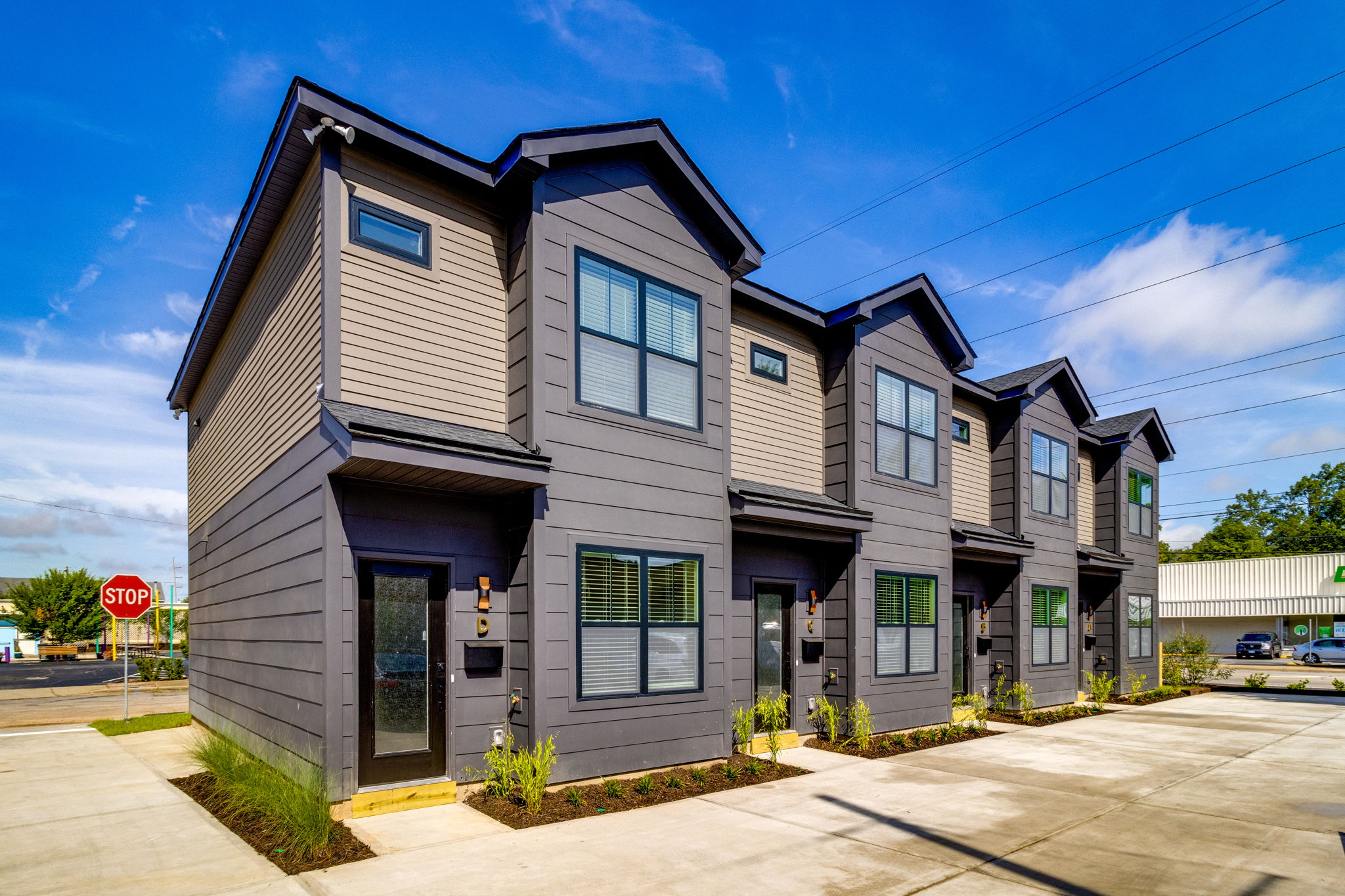 Front view of WilsonCo-built student housing townhomes with modern dark siding in Columbia South Carolina