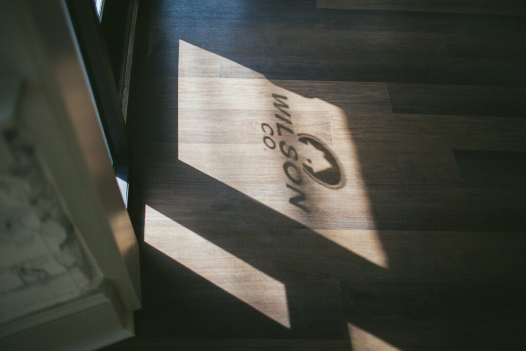 Shadow of The Wilson Co logo cast through glass front door at Columbia South Carolina office